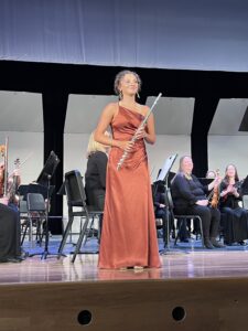 Iris performs her flute with the NSO