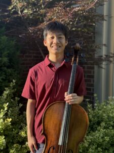 Michael Fang smiles with his cello